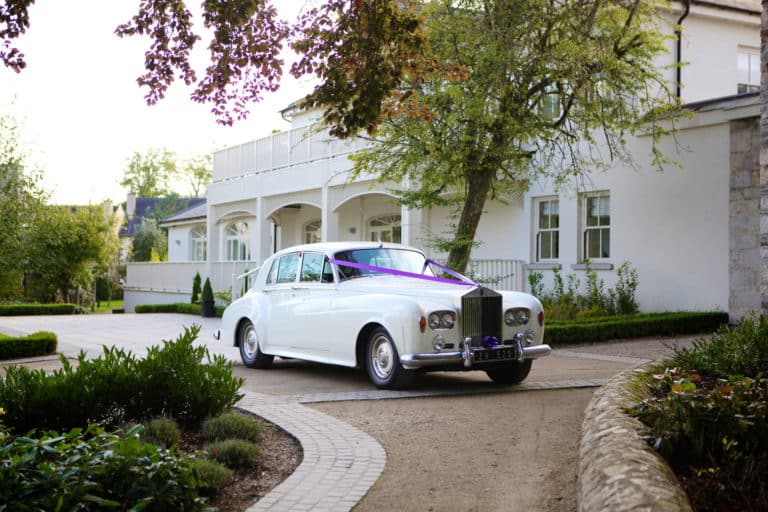 Classic white wedding car at Tulfarris Hotel & Golf Resort Wicklows Wedding Venue