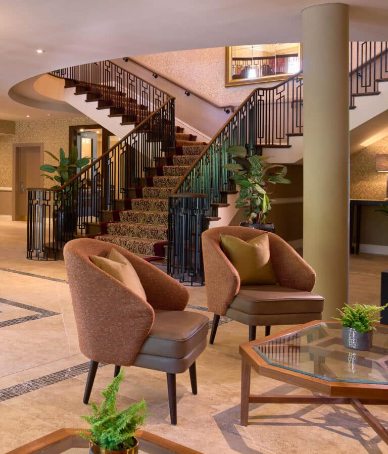 Tulfarris Foyer staircase with 2 chairs